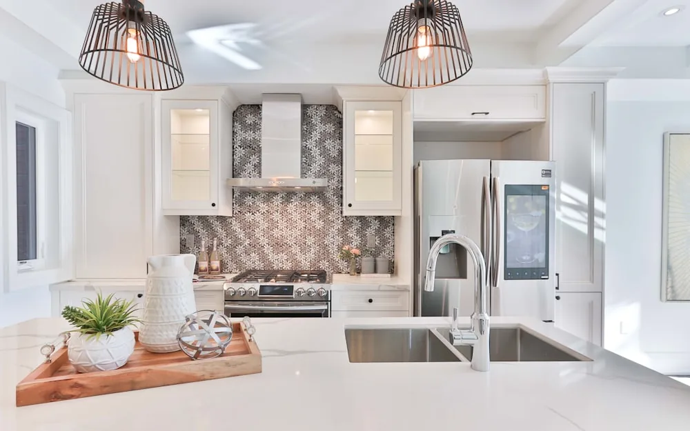 Spring sunlight falling across a clean, bright kitchen.